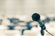 © Chinnapong - Microphone voice speaker in seminar classroom, lecture hall, town hall meeting or conference forum in educational business event for coaching host or teacher with audiences or students seats