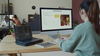 Medium rear shot of young Asian female programmer in casual sweatshirt writing AI software code on laptop, running on desktop computer to check for bugs, then typing to correct algorithm