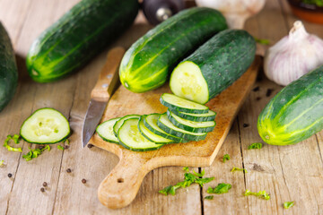 Sticker - sliced cucumbers on wooden cutting board