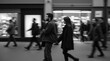 © Dmytriy - An urban scene with blurred figures of people walking down the street
