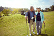 © peopleimages.com - Golf, smile and walking with senior couple outdoor on course together for leisure activity. Grass, mockup space and retirement with happy old people playing sports for bonding or recreation in summer