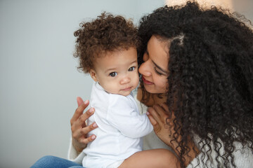 Wall Mural - Love of a mother and baby. Family in the house. Lifestyle