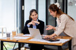 © David - Two asian business women Accounting using calculating income-expenditure and analyzing real estate investment documents data report Financial and tax systems concept.
