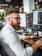 © siripimon2525 - Professional Male Developer Working in Modern Office Environment