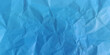 © Creative - Crumpled blue paper background texture
