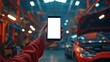 © kayudamar - Hand Holding Smartphone in Auto Repair Shop