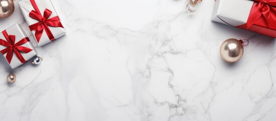 Aufkleber - Christmas presents with silver and red decorations on white marble surface top view festive holiday background