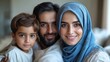 © Muamanah - Happy Muslim Family Portrait: A Close-Knit Family of Three