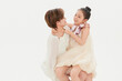 © 亮亮 徐 - Beautiful mother and cute daughter portrait on white background