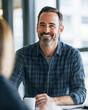 © Colors of Earth Co. - Engaged consultant: Confident leader facilitating meaningful discussions in a well-lit, professional environment