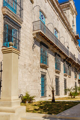 Wall Mural - A building with blue windows and a white pillar