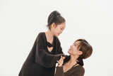Beautiful mother and cute daughter portrait on white background