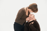 Beautiful mother and cute daughter portrait on white background