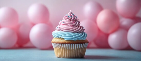 Wall Mural - Cupcake with pink and blue frosting surrounded by pastel balloons ideal for celebration or gifting a special occasion for women