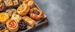 © CreativeBro - Traditional pastry assortment with dry fruits on a tray for eastern new year spring celebration festive display and cultural treats