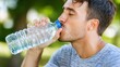© orendesain99 - Man Drinking Water Outdoors, Refreshment and Hydration, Summer Day