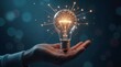 © NoblePix - Hand holding digital light bulb network. New ideas and business innovation. Surrealism.
