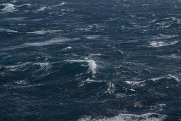 Wall Mural - dark, turbulent ocean waves create dramatic seascape, showcasing power of nature