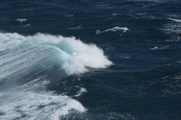 Wall Mural - majestic ocean waves crashing against each other create stunning seascape. deep blue water contrasts