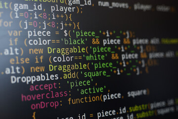 Colorful and complex JavaScript code displayed on a computer screen, highlighting various syntax elements. Focus on programming details and coding structure