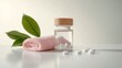 © homeganko - White tablets and a towel placed next to a glass jar on a clean surface