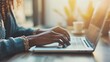 © AlfaSmart - Woman using Laptop at a Cozy Workspace, Remote Work and Modern Lifestyle Concept