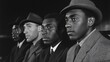 © Alexey - Four stylish men in vintage hats and suits. Classic black and white portrait from 1950s. Historical urban fashion photography showing african american and caucasian individuals side by side