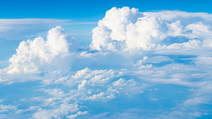 Wall Mural - Blue sky with clouds in the sky. Beautiful blue sky background with clouds.Natural and cloudy fresh blue sky background. White fluffy clouds in the blue sky.