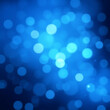 © Pro Creator - blurry Blue bokeh lights against black background in aerial view