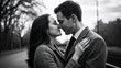 © Irina Kado - Affectionate couple sharing a farewell kiss in black and white. Affectionate farewell