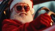 © Rustam - Santa Claus sitting confidently in a sleek car. Wearing cool sunglasses, with his right hand firmly on the steering wheel and his left arm casually hanging out of the open window.
