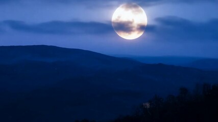 Wall Mural - serene night, majestic moon: a breathtaking landscape photograph captures the ethereal beauty of a f