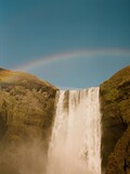 waterfall in rainbow in iceland