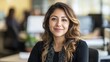 © Netthida Arsa - Professional Latina Executive Leading a Multicultural Team in a Modern Office Environment with a Warm Smile and Confident Posture