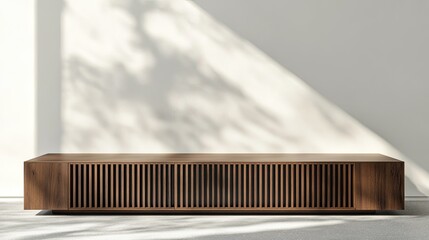 Wall Mural - Low wooden media console with slatted front, sunlight shadows on wall.