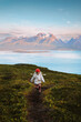 © EVERST - Kid running in mountains traveling in Norway child hiking family lifestyle outdoor activity adventure vacations, girl exploring scandinavian nature