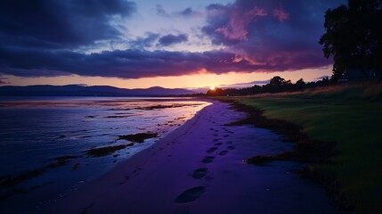 Wall Mural - Sunset beach scene with footprints in sand. (1)