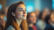 © Michael - Hopeful university student attending a business conference, listening to a presentation