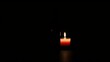 © Vibrant Visions Pixe - A single lit candle casting a warm glow against a dark backdrop, symbolizing hope and light in darkness.