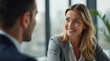 © Alex Pios - close-up of two colleagues actively listening to each other during a one-on-one conversation, showcasing the importance of empathy in fostering strong professional relationships
