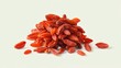 © Metthaisonk - Pile of vibrant red goji berries on a plain background, showcasing their rich texture and color.