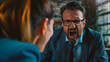© mahamad - Angry irate boss yelling and shouting at his secretary employee.