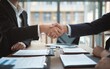 © Rezhwan - Professional Handshake Symbolizing Successful Business Agreement