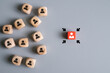 © BritCats Studio - Cube with business person icon on red cube spot with focus arrow. Leadership concept that employee got promotion in career. Human resource that search for talent employee with successful career.