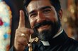 © Alla - A man wearing a beard and holding a cross on his finger, suitable for use in scenes about spirituality or cultural traditions
