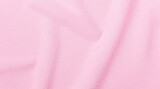Soft, pink fabric with a subtle texture and gentle folds. Ideal for backgrounds, textures, or representing delicate materials like cotton or fleece.