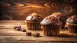 © PloyJai - Delicious chocolate muffins with nuts on rustic wooden surface