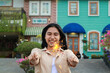 © M Alfan Setyawan - happy young asian woman holding sparkler celebrating new year eve in vintage house yard, outdoor garden