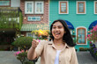 © M Alfan Setyawan - portrait of beautiful happy young asian woman holding sparklers fireworks to celebrate new year eve with garden party standing in outdoor vintage house yard
