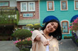 © M Alfan Setyawan - happy young asian woman holding sparkler enjoy new year eve celebration in outdoor garden of colorful vintage house in evening